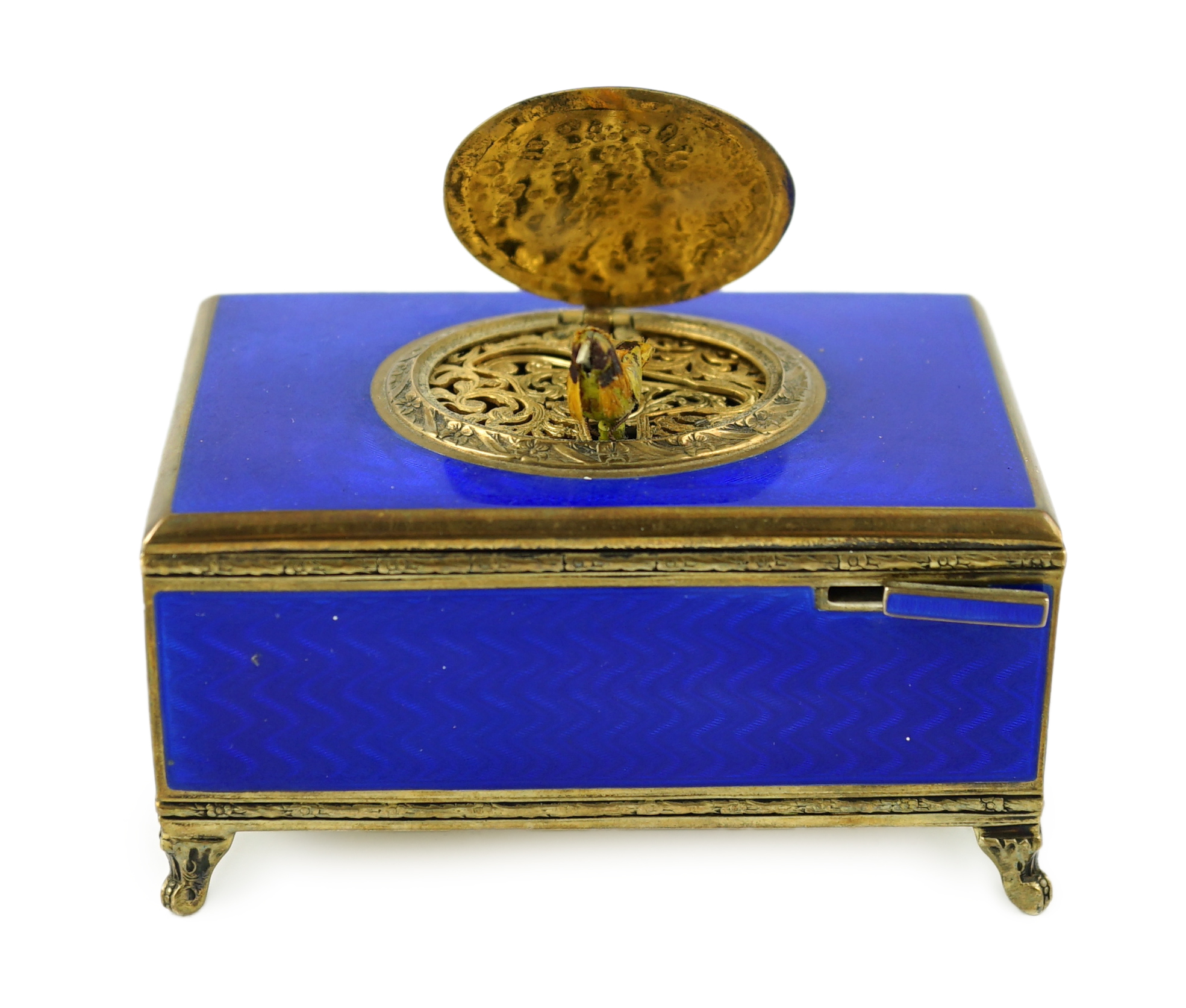 An early 20th century sterling silver gilt and blue guilloche enamelled rectangular singing bird box